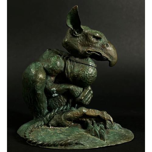 551 - A cast bronze grotesque Gothic nightmare creature tethered with a collar and rope, signed C Daniel t... 