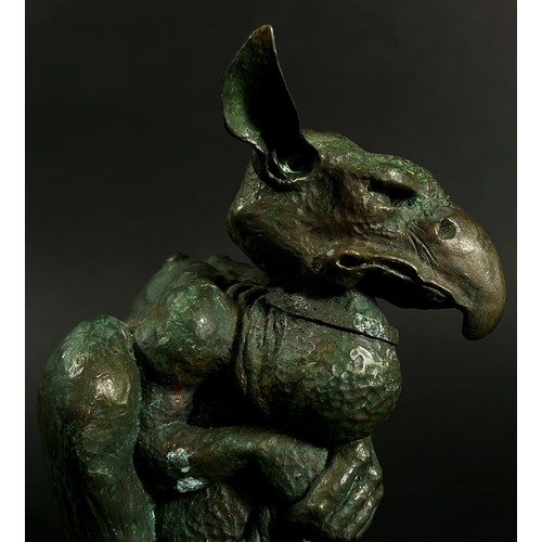 551 - A cast bronze grotesque Gothic nightmare creature tethered with a collar and rope, signed C Daniel t... 