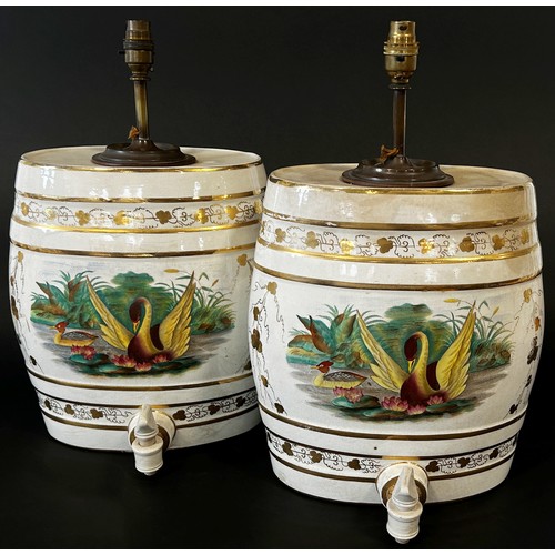 6 - A pair of decorative ceramic spirit barrels with gilt borders and painted pond side vignettes (conve... 