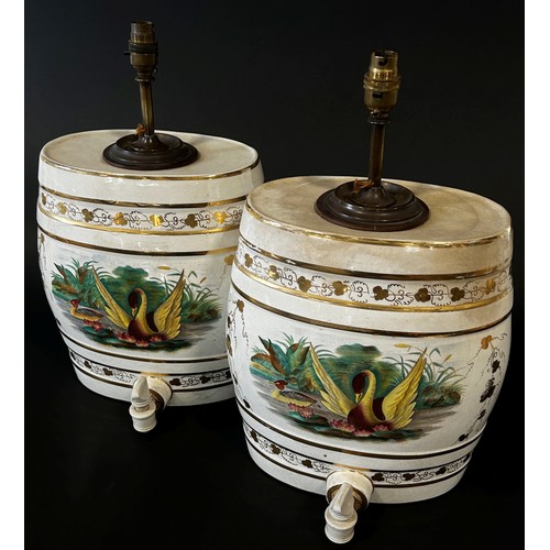 6 - A pair of decorative ceramic spirit barrels with gilt borders and painted pond side vignettes (conve... 