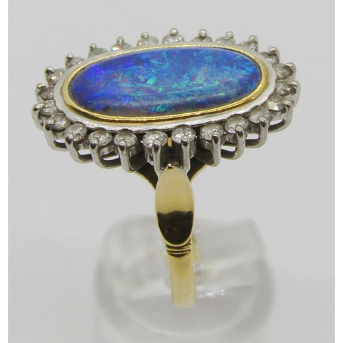 288 - Good quality 18ct oval opal and diamond cluster ring, opal 18 x 10mm approx, size R, 9.2g (see photo... 