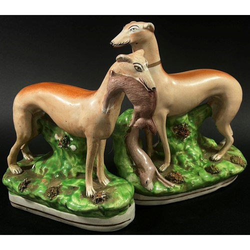 31 - Four Staffordshire greyhound models, the largest 24 cm high (4)