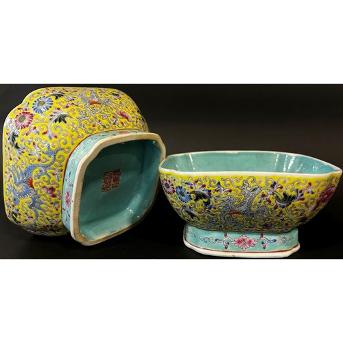 47 - A pair of Chinese enamelled porcelain square footed bowls of squared form, decorated with mythical b... 