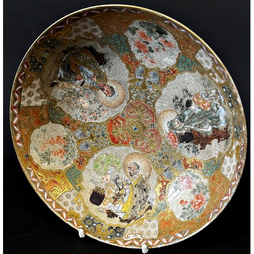 54 - A late 19th century Japanese Satsuma export earthenware dish, highly detailed, decorated with figura... 