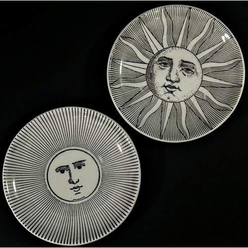 70 - A pair of Italian Fornasetti dishes in the Soli E Lune range, each 8 cm diameter (2)