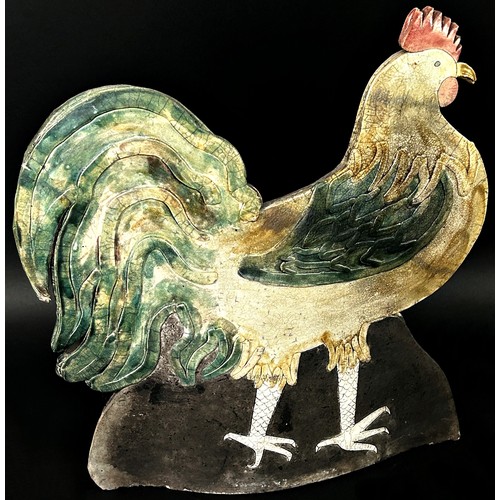 81 - A large and decorative Studio ware model of a stylised cockerel with partially glazed finish and imp... 