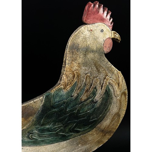 81 - A large and decorative Studio ware model of a stylised cockerel with partially glazed finish and imp... 