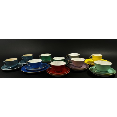 83 - A collection of mixed brightly coloured late 19th century and later porcelain tea and coffee wares (... 