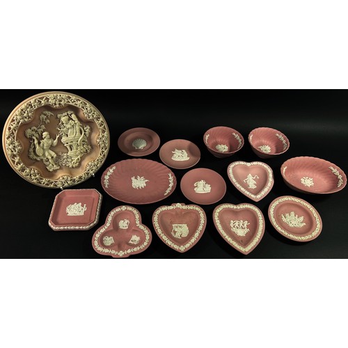 102 - A large Collection of pink ground Wedgwood jasperware to include candlesticks, posy vases, picture f... 