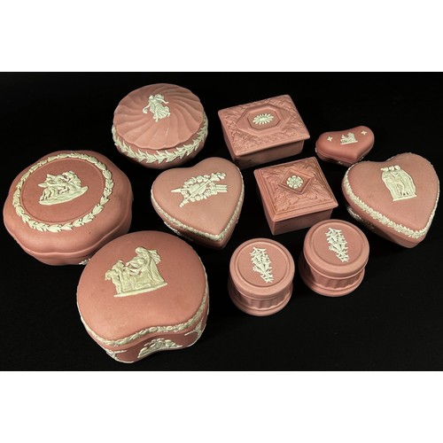 102 - A large Collection of pink ground Wedgwood jasperware to include candlesticks, posy vases, picture f... 