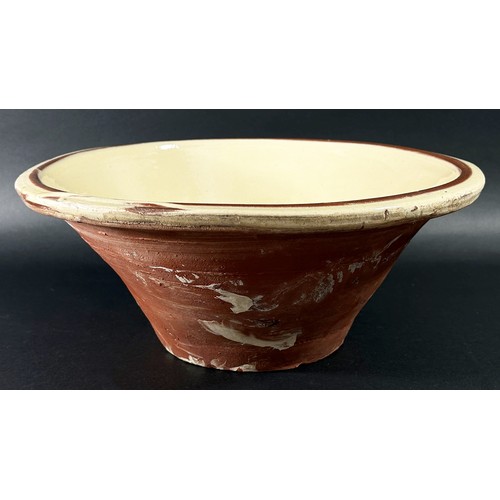 86 - A large glazed terracotta dairy bowl of tapering cylindrical form 15 cm high, 36 cm diameter