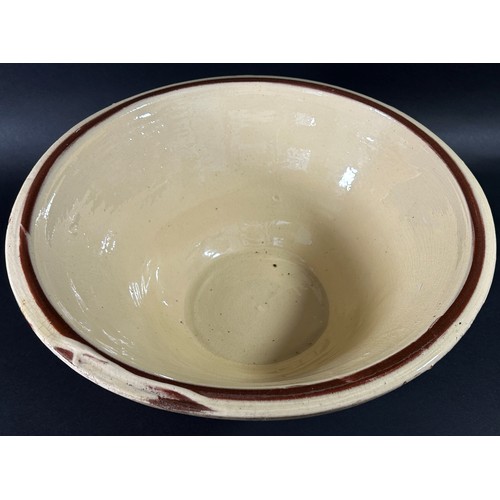 86 - A large glazed terracotta dairy bowl of tapering cylindrical form 15 cm high, 36 cm diameter