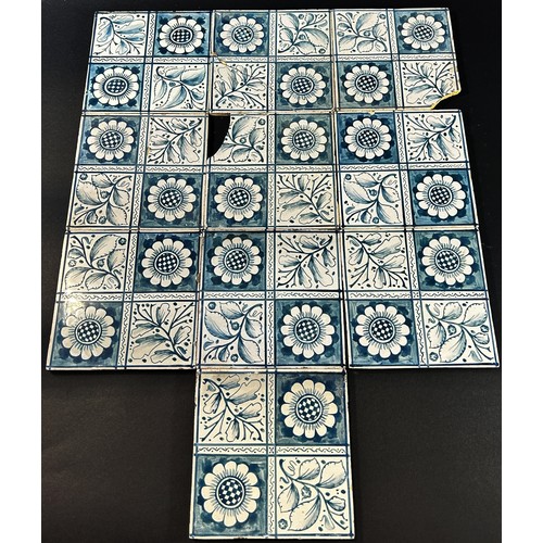 90 - A collection of 18th century and later blue and white Delft tiles, various designs, 35 in total appr... 