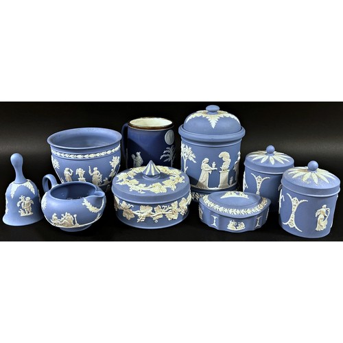 107 - A mixed collection of mostly blue ground Wedgwood jasperware items to include a lidded storage jar, ... 