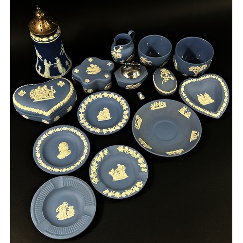 107 - A mixed collection of mostly blue ground Wedgwood jasperware items to include a lidded storage jar, ... 