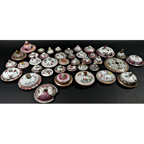 41 - A large and interesting selection of 18th century and later pot and jar covers, principally Chinese ... 