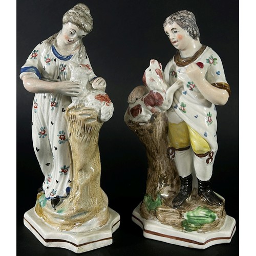 78 - A pair of 18th century Staffordshire figures each 18 cm high together with a small 18th century salt... 