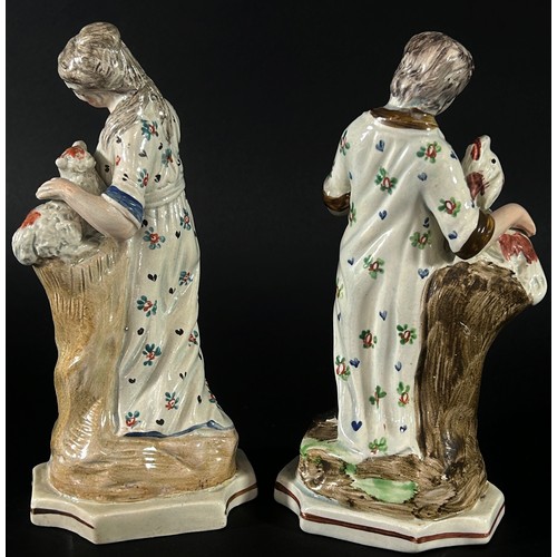 78 - A pair of 18th century Staffordshire figures each 18 cm high together with a small 18th century salt... 