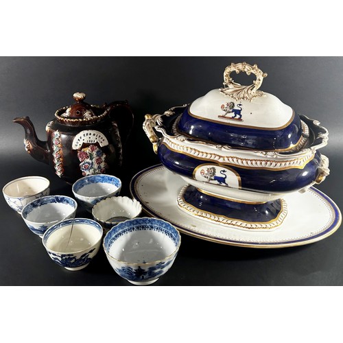 123 - A mixed group of 18th century and later porcelain to include a large twin handled armorial serving t... 