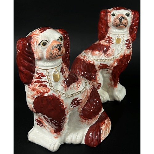 112 - A mixed decorative collection to include a large pair of Staffordshire pottery spaniels, novelty spe... 