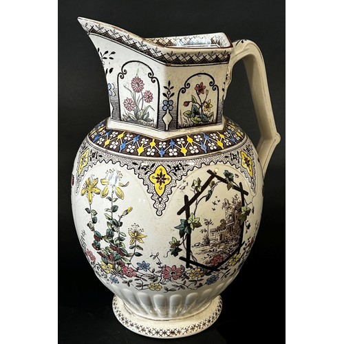 146 - A mid Victorian period rustic pattern ewer (34cm high) together with a marbled glass fish (2)