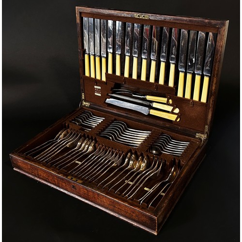 173 - A mahogany canteen containing silver plated and stainless steel cutlery