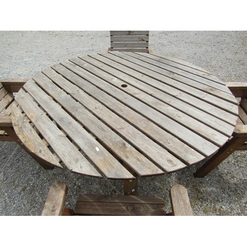 1161 - A weathered rustic five piece garden suite compris8ing circular top table and four open armchairs wi... 