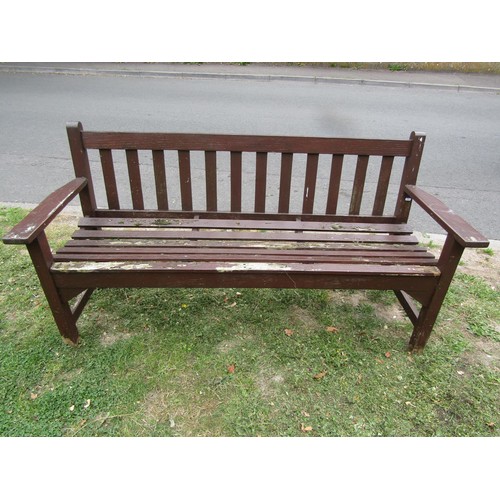 1182 - A vintage stained teak three seat garden bench with slatted seat and back, 159 cm long (af)