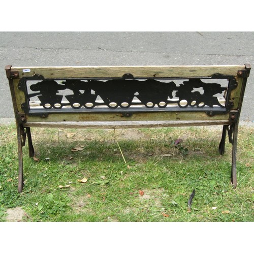 1183 - A child's size weathered garden bench with cast iron panelled back and end supports, 83 cm long (af)