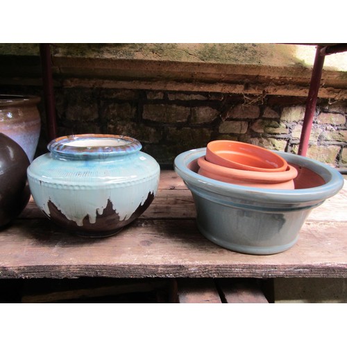 1185 - A collection of good quality contemporary glazed planters of varying size, design and colourway, two... 