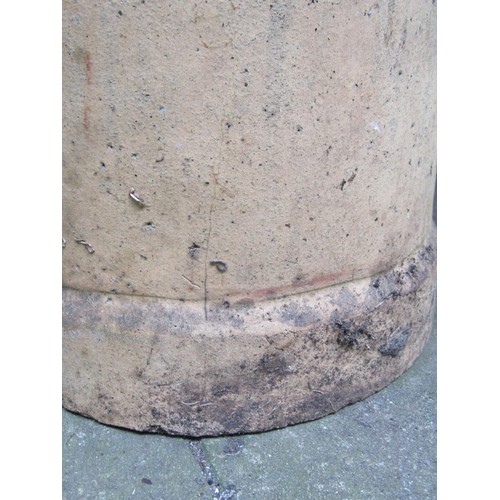 1190 - A pair of weathered buff coloured cylindrical chimney pots, 60 cm high