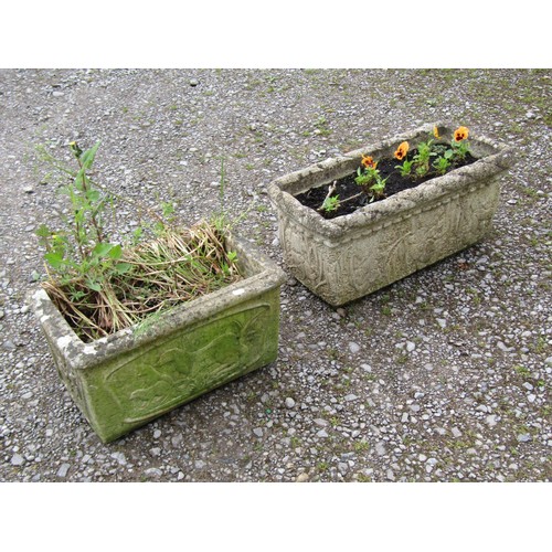 1156 - Two weathered cast composition stone rectangular flower troughs of varying design with relief detail... 