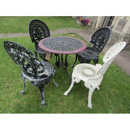 1192 - A painted and weathered cast alloy garden terrace table or circular form with decorative pierced top... 