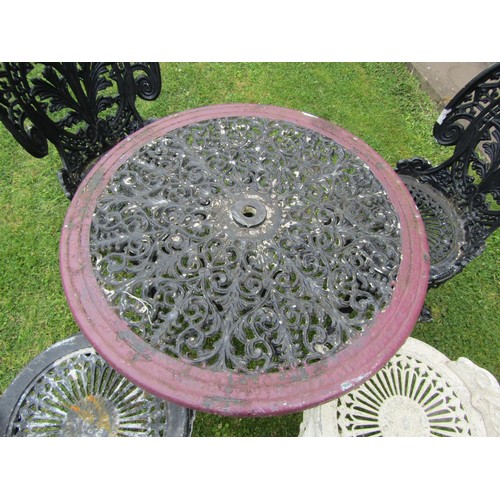 1192 - A painted and weathered cast alloy garden terrace table or circular form with decorative pierced top... 