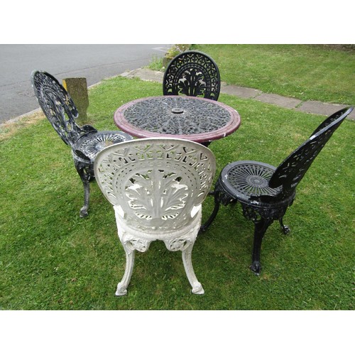 1192 - A painted and weathered cast alloy garden terrace table or circular form with decorative pierced top... 