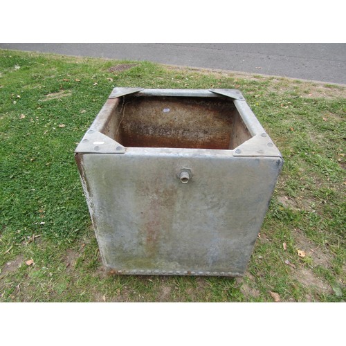 1193 - A vintage heavy gauge galvanised steel water tank of square cut form with pop riveted seams, 50 cm s... 