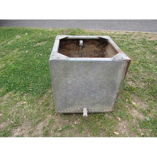 1193 - A vintage heavy gauge galvanised steel water tank of square cut form with pop riveted seams, 50 cm s... 