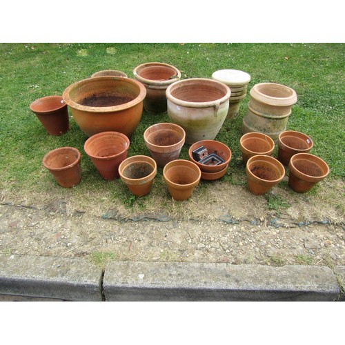 1196 - A quantity of weathered terracotta flower pots and planters of varying size and design, etc, (some A... 