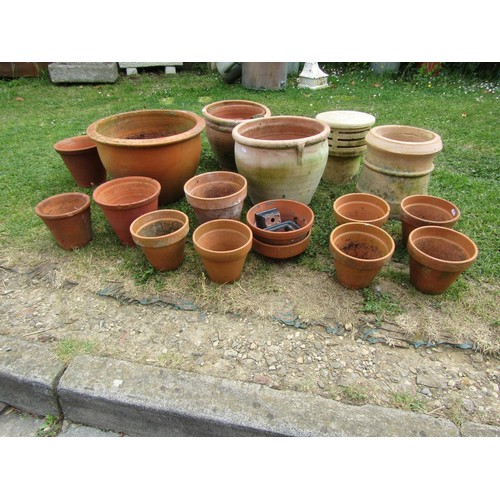 1196 - A quantity of weathered terracotta flower pots and planters of varying size and design, etc, (some A... 