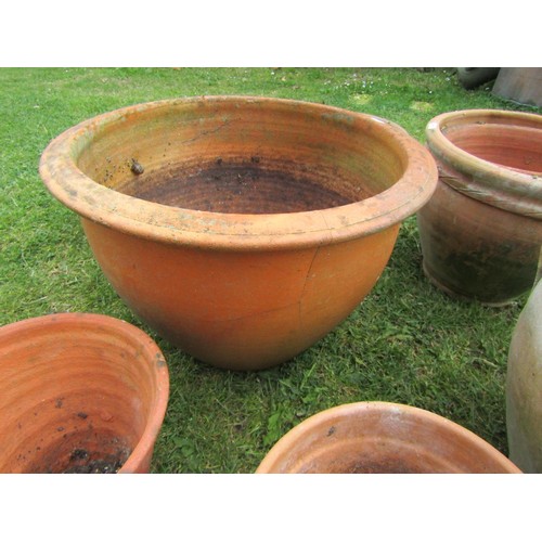 1196 - A quantity of weathered terracotta flower pots and planters of varying size and design, etc, (some A... 