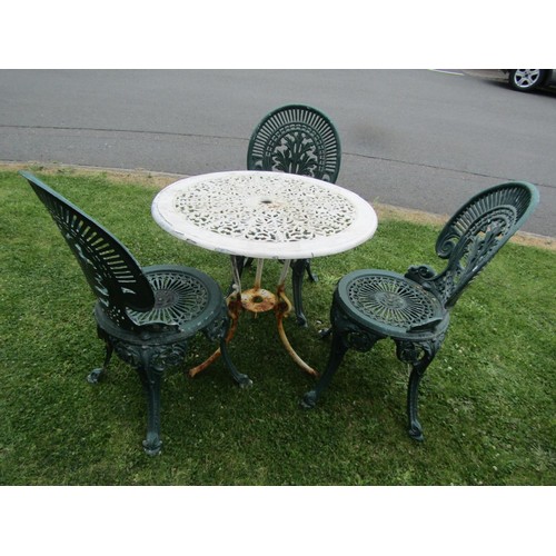 1197 - A painted and weathered cast iron and alloy garden terrace table with decorative pierced circular to... 