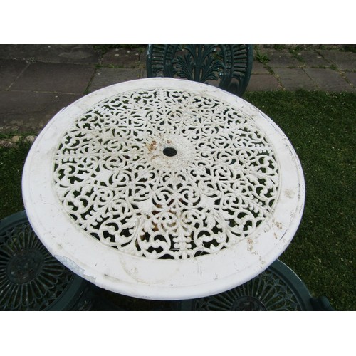 1197 - A painted and weathered cast iron and alloy garden terrace table with decorative pierced circular to... 