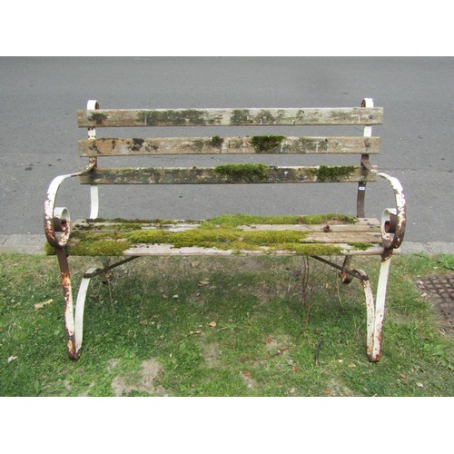 1198 - A vintage two seat garden bench with weathered timber slats raised on sprung steel supports, 122 cm ... 