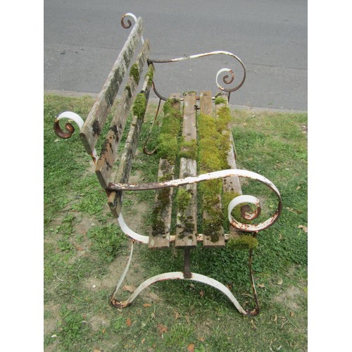 1198 - A vintage two seat garden bench with weathered timber slats raised on sprung steel supports, 122 cm ... 