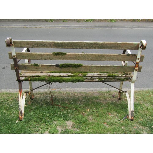 1198 - A vintage two seat garden bench with weathered timber slats raised on sprung steel supports, 122 cm ... 