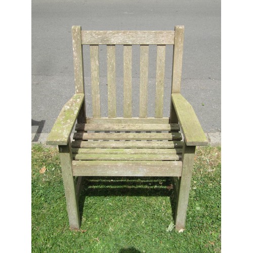 1202 - A weathered Lister teak two seat garden bench with slatted seat and back, 128 cm long together with ... 