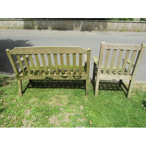 1202 - A weathered Lister teak two seat garden bench with slatted seat and back, 128 cm long together with ... 