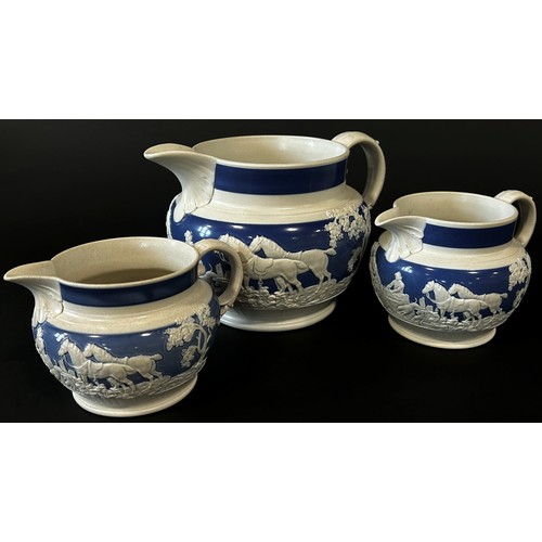 132 - A graduating trio of 19th century banded moulded salt glazed jugs of squat bulbous form, each decora... 