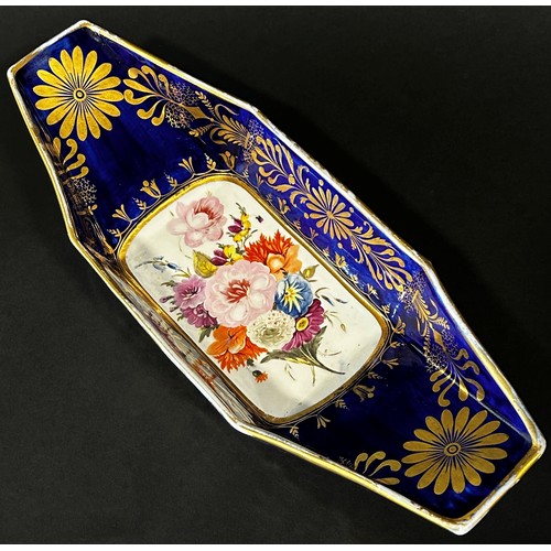 126 - A 19th century continental porcelain bread dish of boat form with cobalt ground, decorated with gilt... 