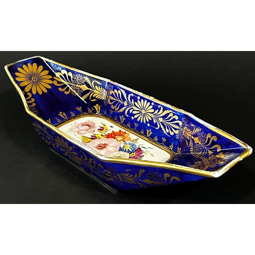 126 - A 19th century continental porcelain bread dish of boat form with cobalt ground, decorated with gilt... 